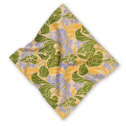 A luxury microfibre lens cloth featuring a V&A Archive pattern of yellow, green and blue florals